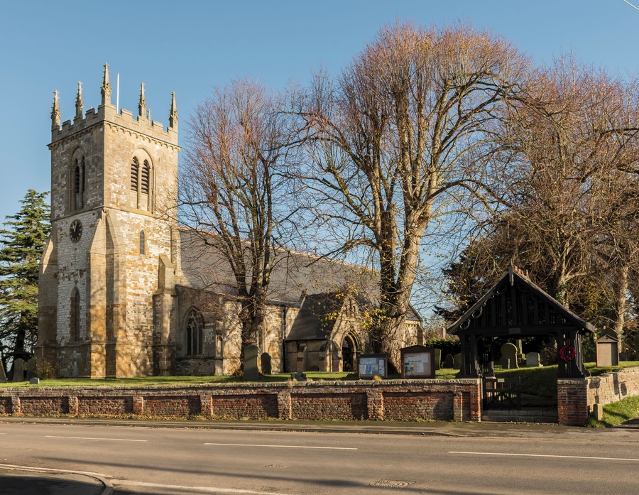 The church dates from the 12th C. onwards and has a western tower, 4 bay aisled nave, 3 bay chancel and south porch. The tower dates from the 13th C. and has 15th C. crocketted pinnacles. The chancel is probably the oldest part, dating from the early 13th C. The church has a 12th C. Tournai Marble font similar to Lincoln Cathedral. The church was restored by J. Fowler in 1884
