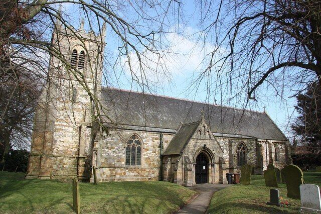 St. Lawrence's church. Mostly of c1200-1300 with some restoration, including a rare, Norman, black Tournai marble font.