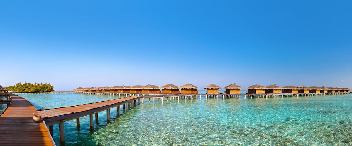 Bungalows on tropical Maldives island