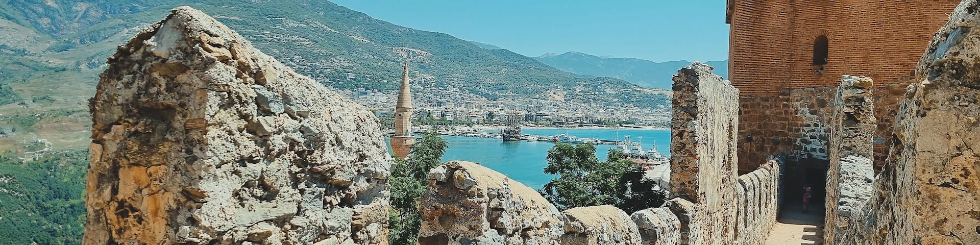 banner of view from old fortress wall of tower, city and sea, as well as minarets of the mosque. Alanya Turkey. soft focus.