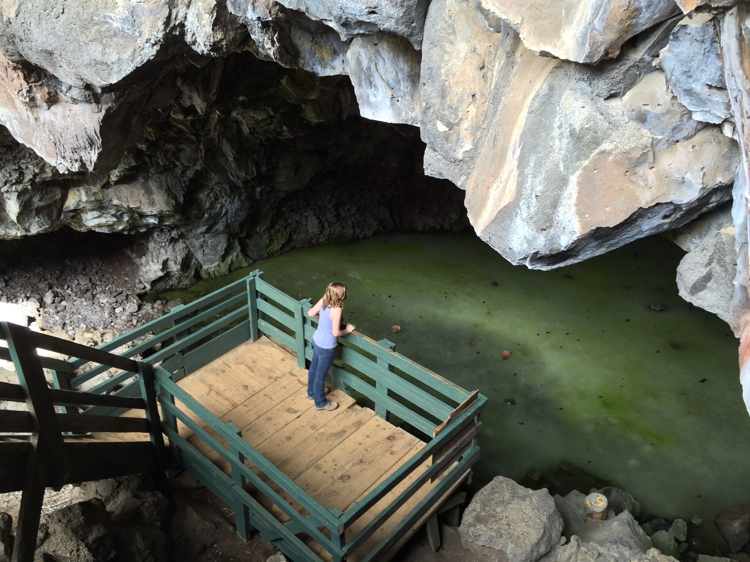This ice cave is the end of a collapsed lava tube 17.5 miles long, the longest known in North America. The coloration is due to algae that lived in the water that filled the cavern which is now frozen to a depth of more than 20 feet. The cave remains a constant 31 degrees F year-round.  