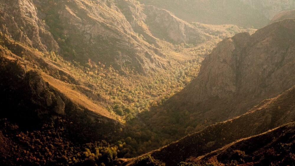 'Close to the Iranian border, Goris is a fascinating terraced town, covered in the dusts of Central Asia. Excellent hub for exploring Tatev Monastery or riding the longest cable car route in the world.'
P.S. This orangeish light falling onto barren rocks sums up Armenian beauty in my mind.