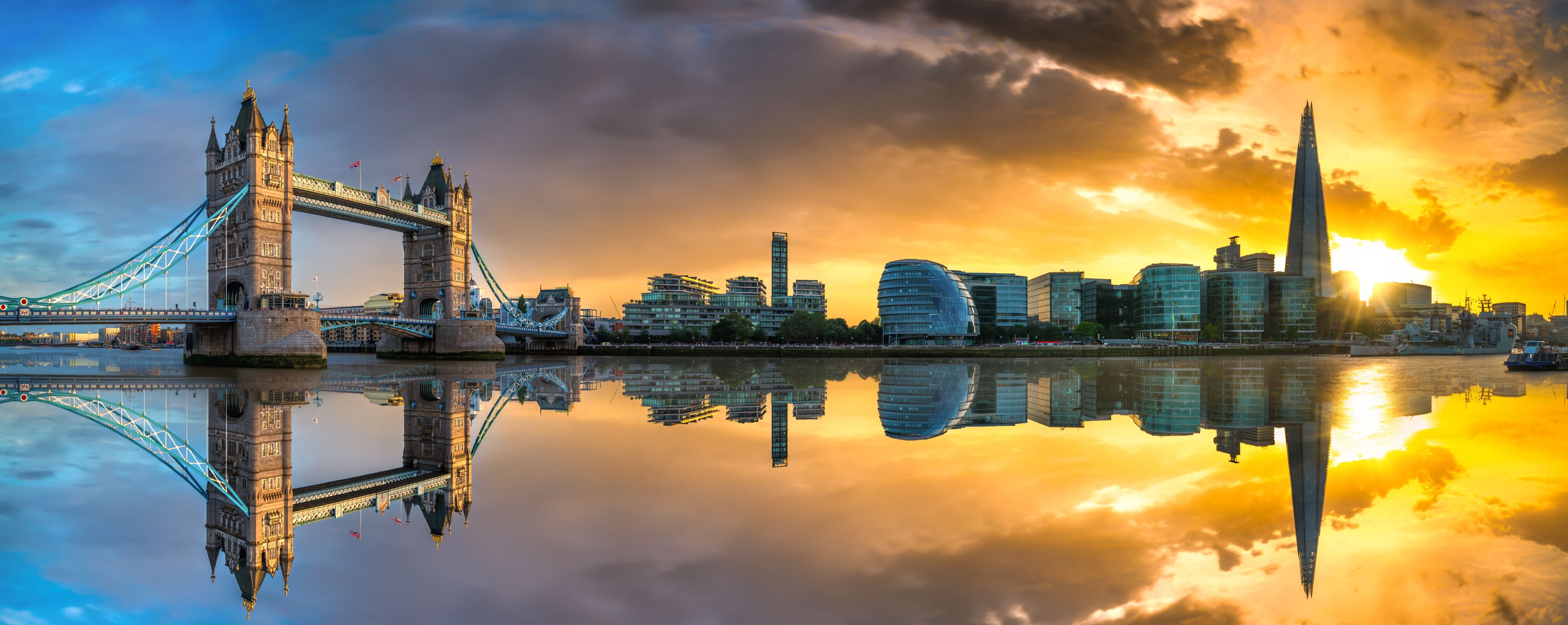 Tower Bridge panorama at sunset in London,. England