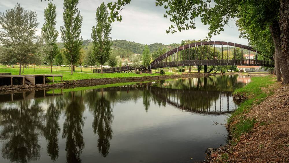 Pedestrian bridge and its reflection, on the Sert√£ river, in Sert√£, Portugal - Ponte pedonal e seu reflexo, sobre a ribeira da Sert√£, na Sert√£, em Portugal