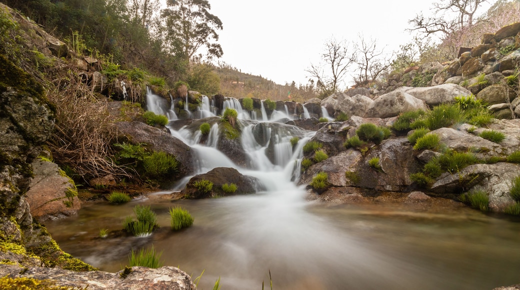 Long exposure of a small waterfall inserted in a pedestrian path in the village of Tondela, Portugal