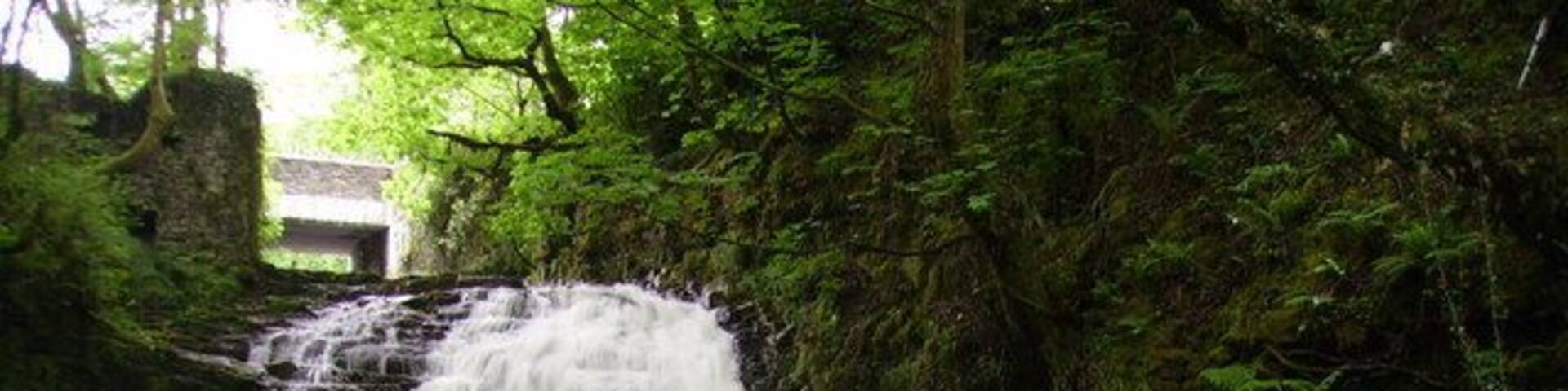 Gwaun -Cae-Gurwen falls The Garnant river at the Waun falls at pwll y wrach . Notice the ruins of the old mill on the top left hand side of the photo.