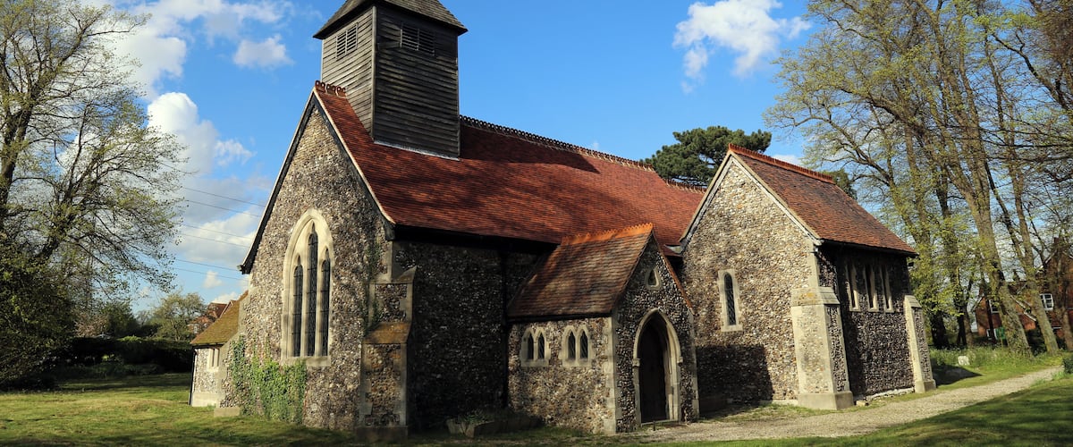 St Mary the Virgin parish church, Stapleford Tawney, Essex, England, seen from the southwest, showing the 12th-century nave and south chapel, and the 19th-century south porch