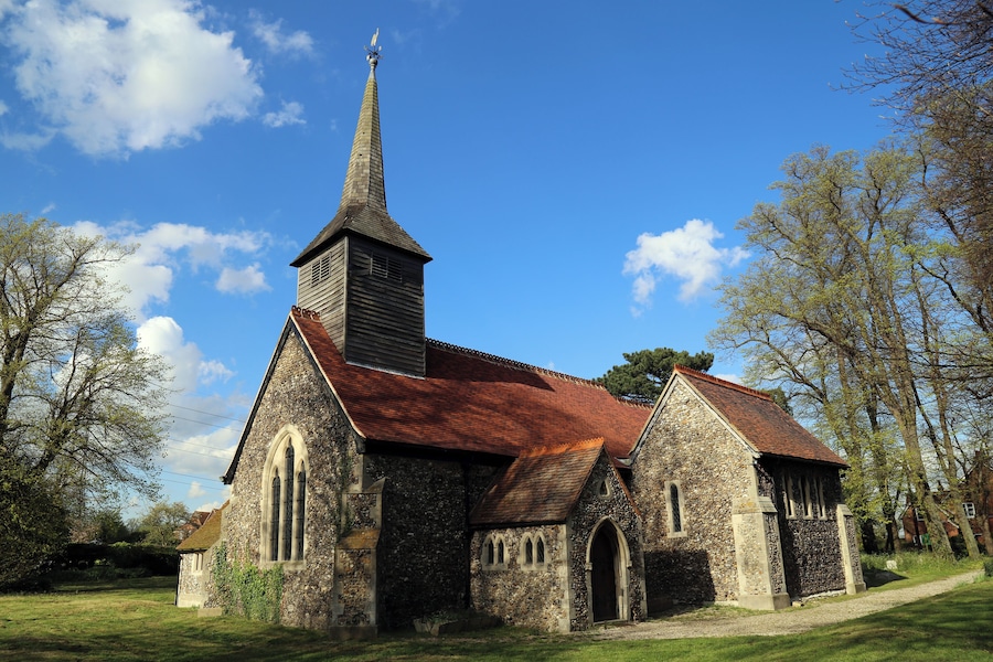 St Mary the Virgin parish church, Stapleford Tawney, Essex, England, seen from the southwest, showing the 12th-century nave and south chapel, and the 19th-century south porch