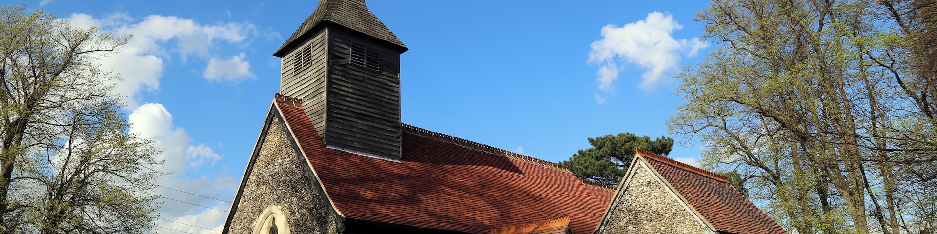 St Mary the Virgin parish church, Stapleford Tawney, Essex, England, seen from the southwest, showing the 12th-century nave and south chapel, and the 19th-century south porch