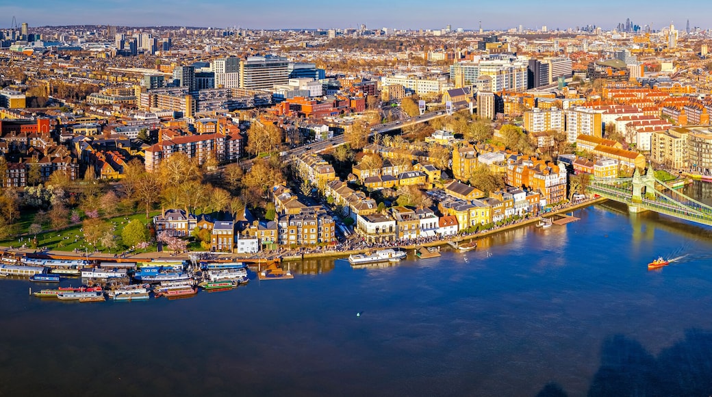 Hammersmith Bridge Over River Thames with London Skyline in Golden Light