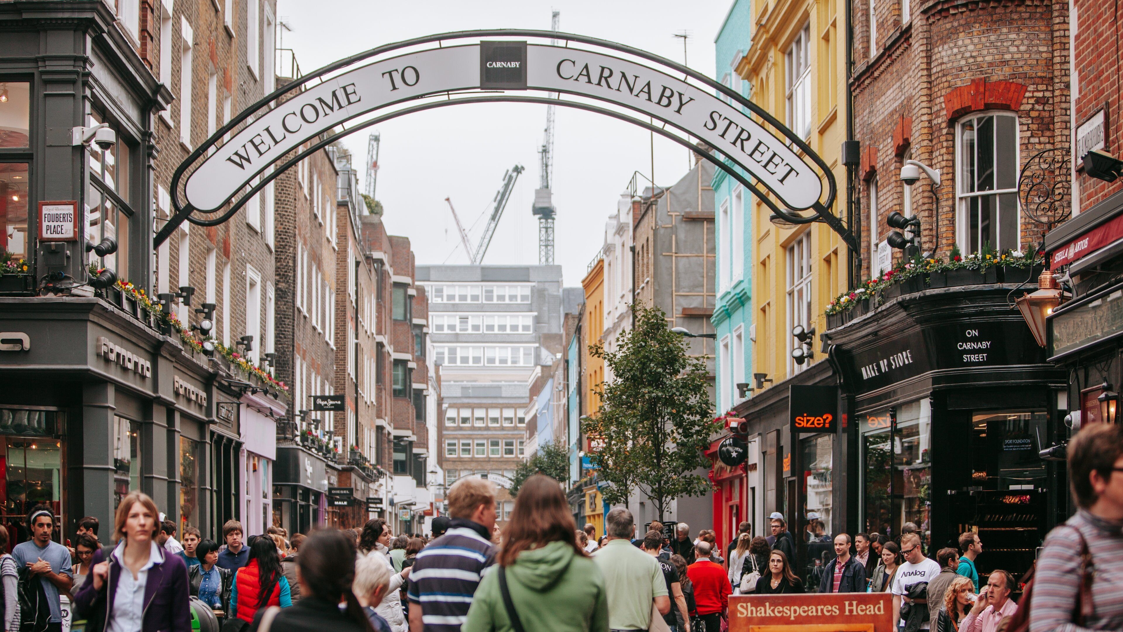 West End which includes a city, street scenes and signage
