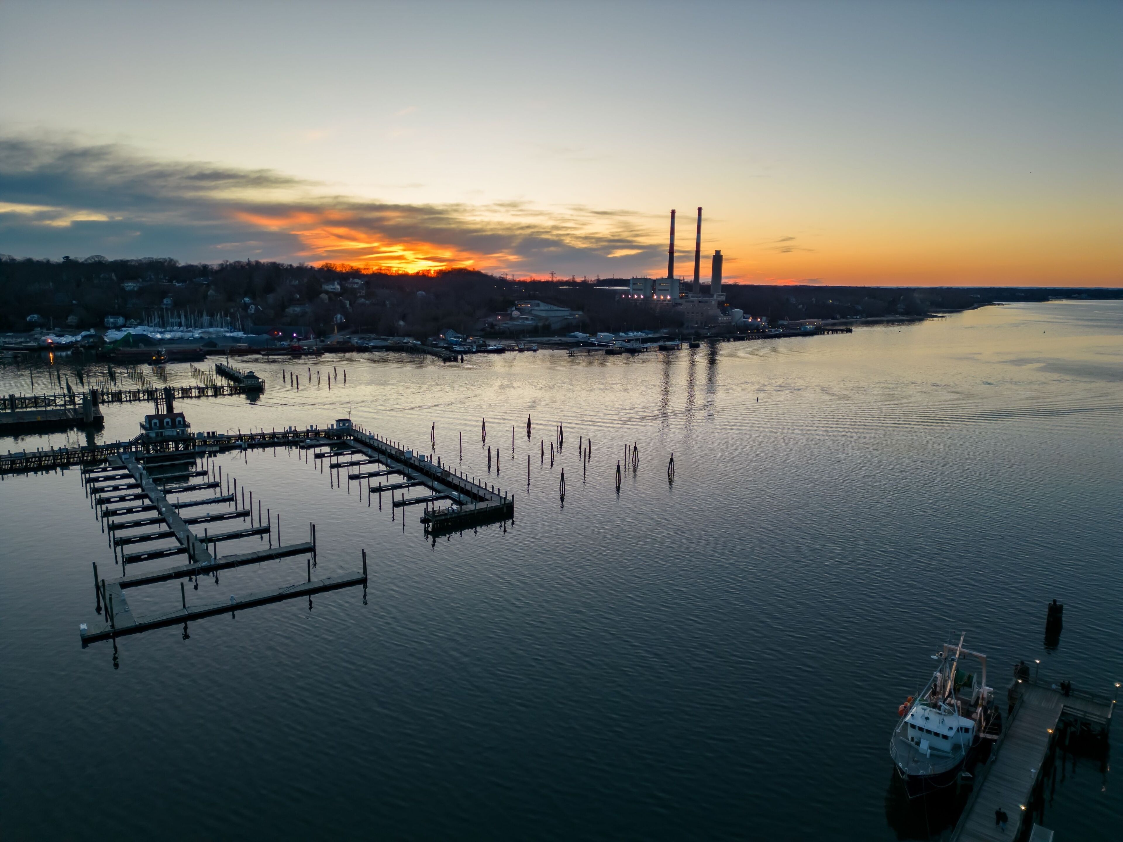 Aerial view of the Port Jefferson Harbor during a beautiful and cloudless sunset in the winter