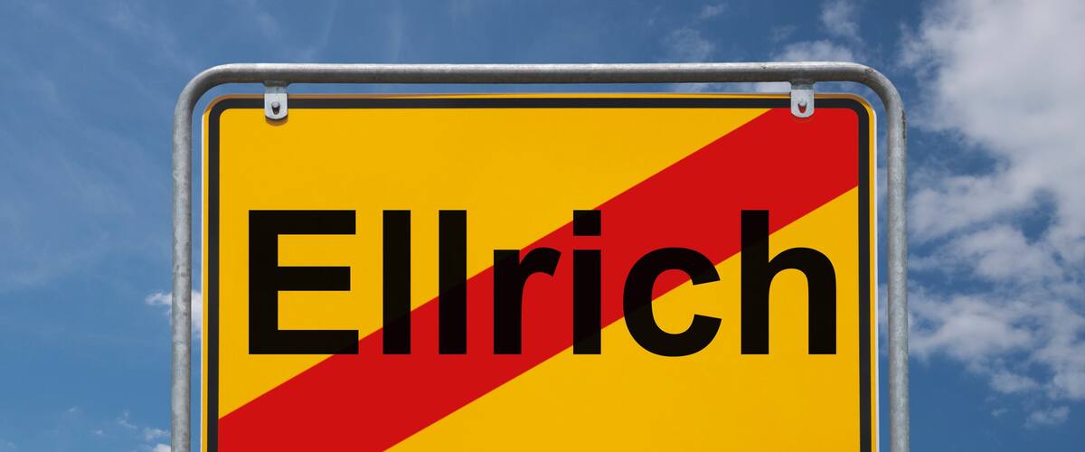 A road sign with the name "Ellrich" on a yellow background with a red diagonal stripe.