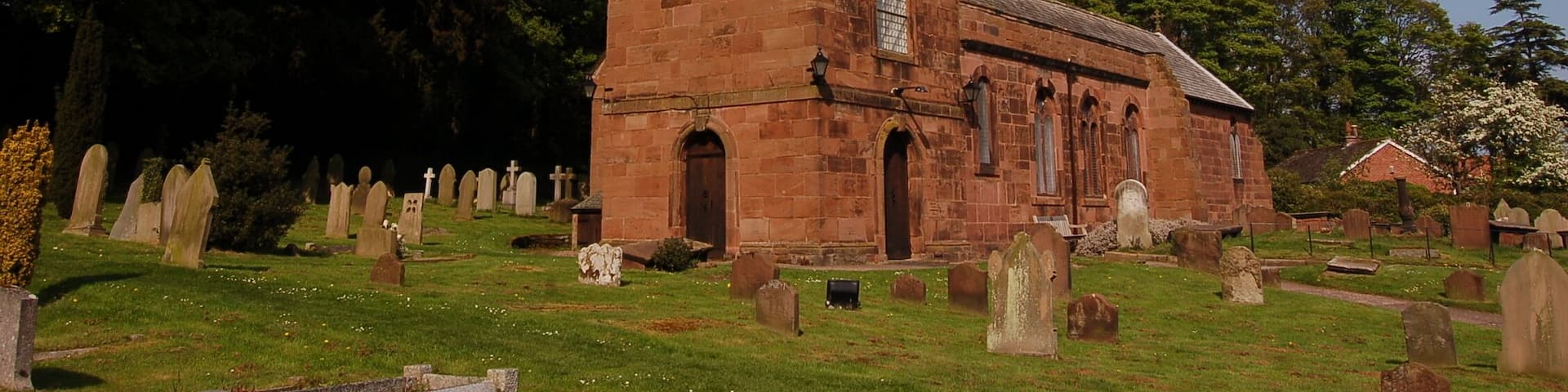 St Nicholas's parish church, Burton, Wirral, Cheshire, seen from the southwest