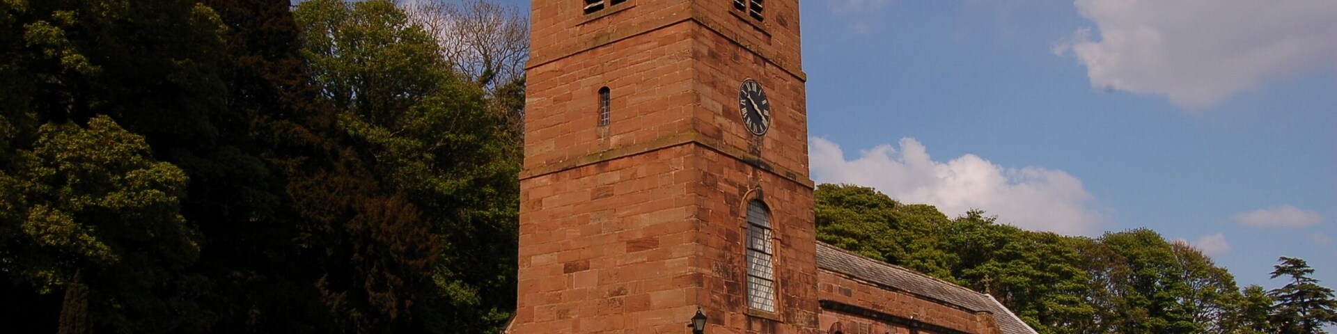 St Nicholas's parish church, Burton, Wirral, Cheshire, seen from the southwest