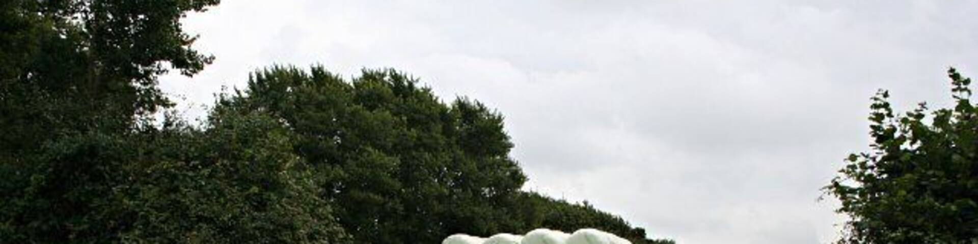 Silage bales at the field edge. These piles of bales wrapped in plastic are a common sight in the countryside.