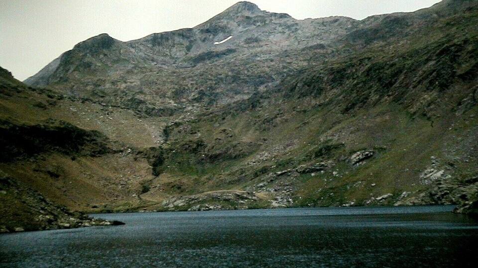 A mountain landscape with a lake.