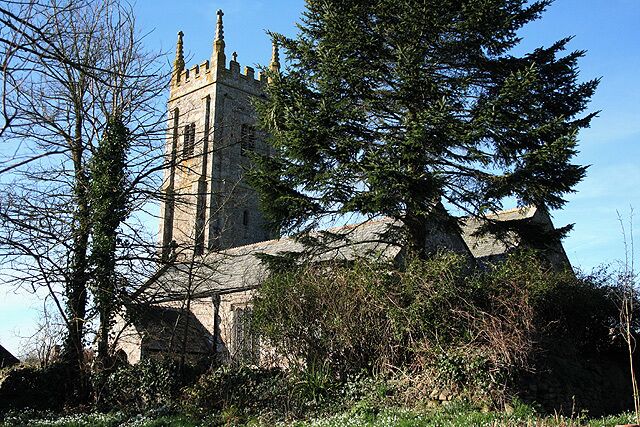 Broadwoodkelly: All Saints Church The church, dedicated to All Saints, has a tower with set-back buttresses. The medieval dedication has been lost. Looking north west