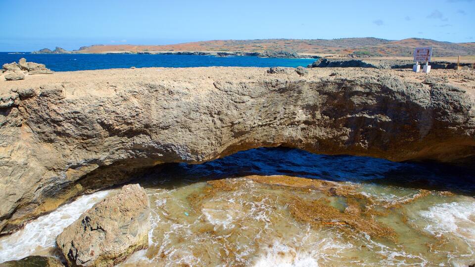 Natural Bridge - Boca Andicuri which includes general coastal views