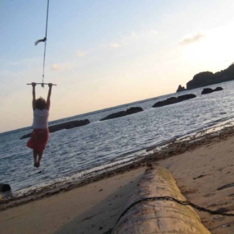 I took this self portrait just up the beach from the Big Easy. Swinging from a palm tree has to be one of the best joys in life :) 