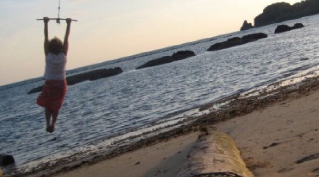 I took this self portrait just up the beach from the Big Easy. Swinging from a palm tree has to be one of the best joys in life :)