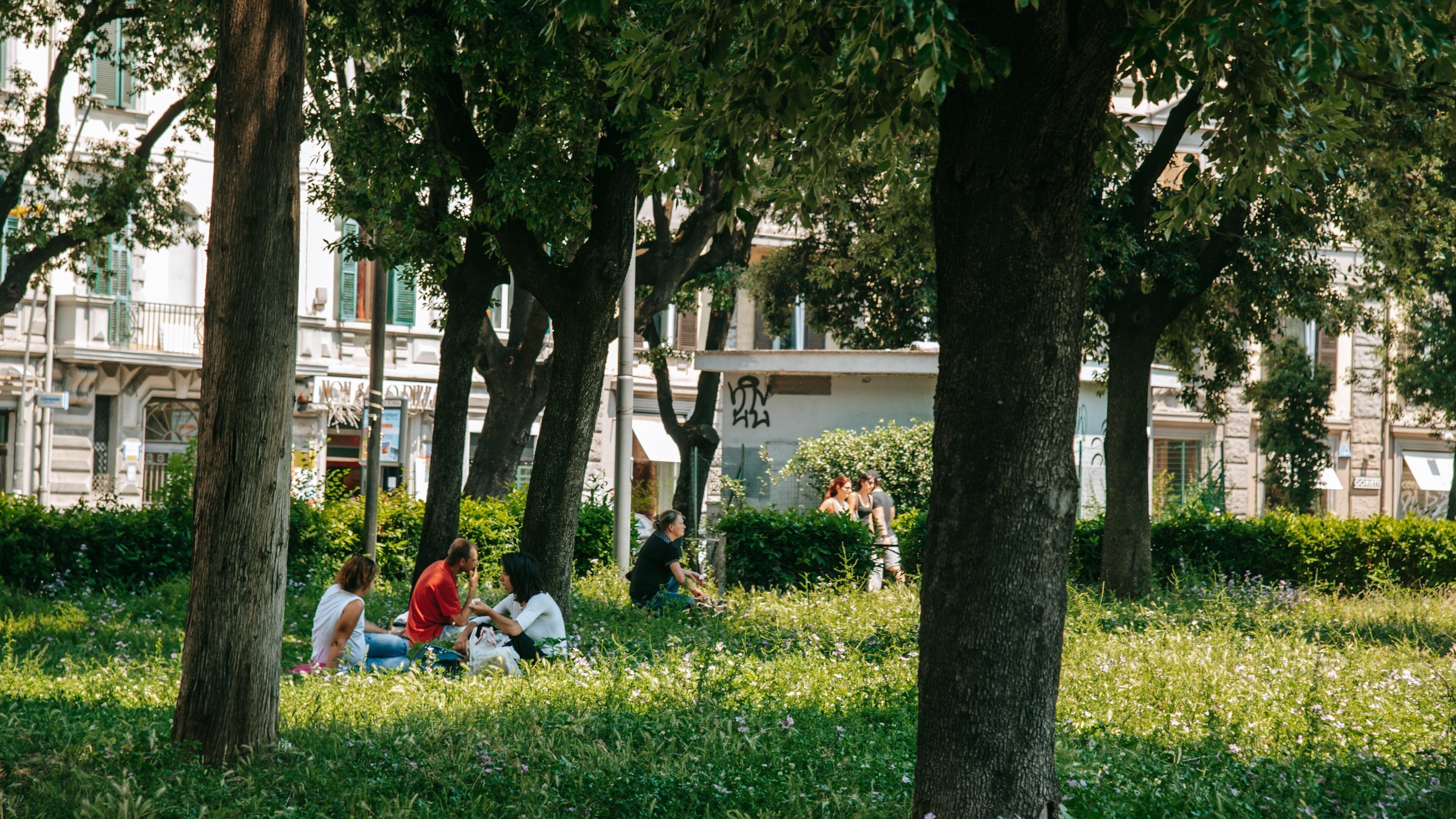 San Giovanni showing a garden as well as a small group of people