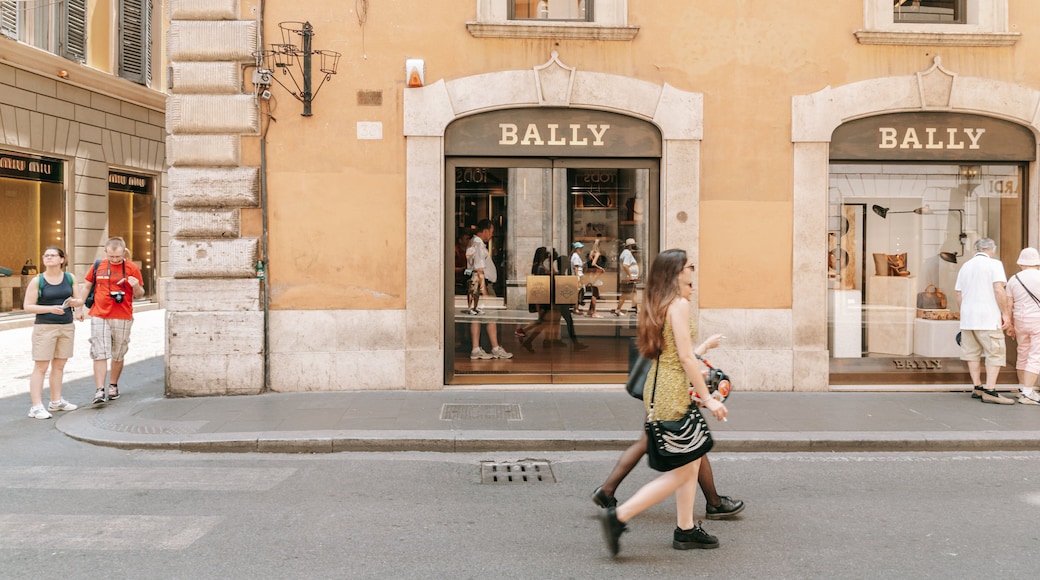 Via Condotti featuring street scenes and signage as well as a couple