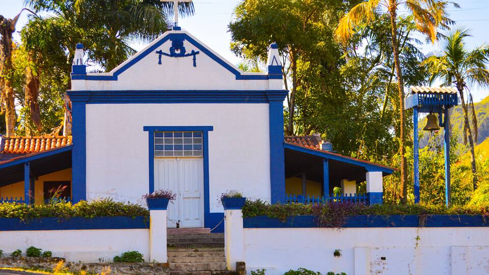 Small chapel in Fazenda Santa Maria, Águas da Prata, Brazil, with charming colonial architecture. The serene surroundings highlight the chapel's peaceful ambiance and historical significance.
