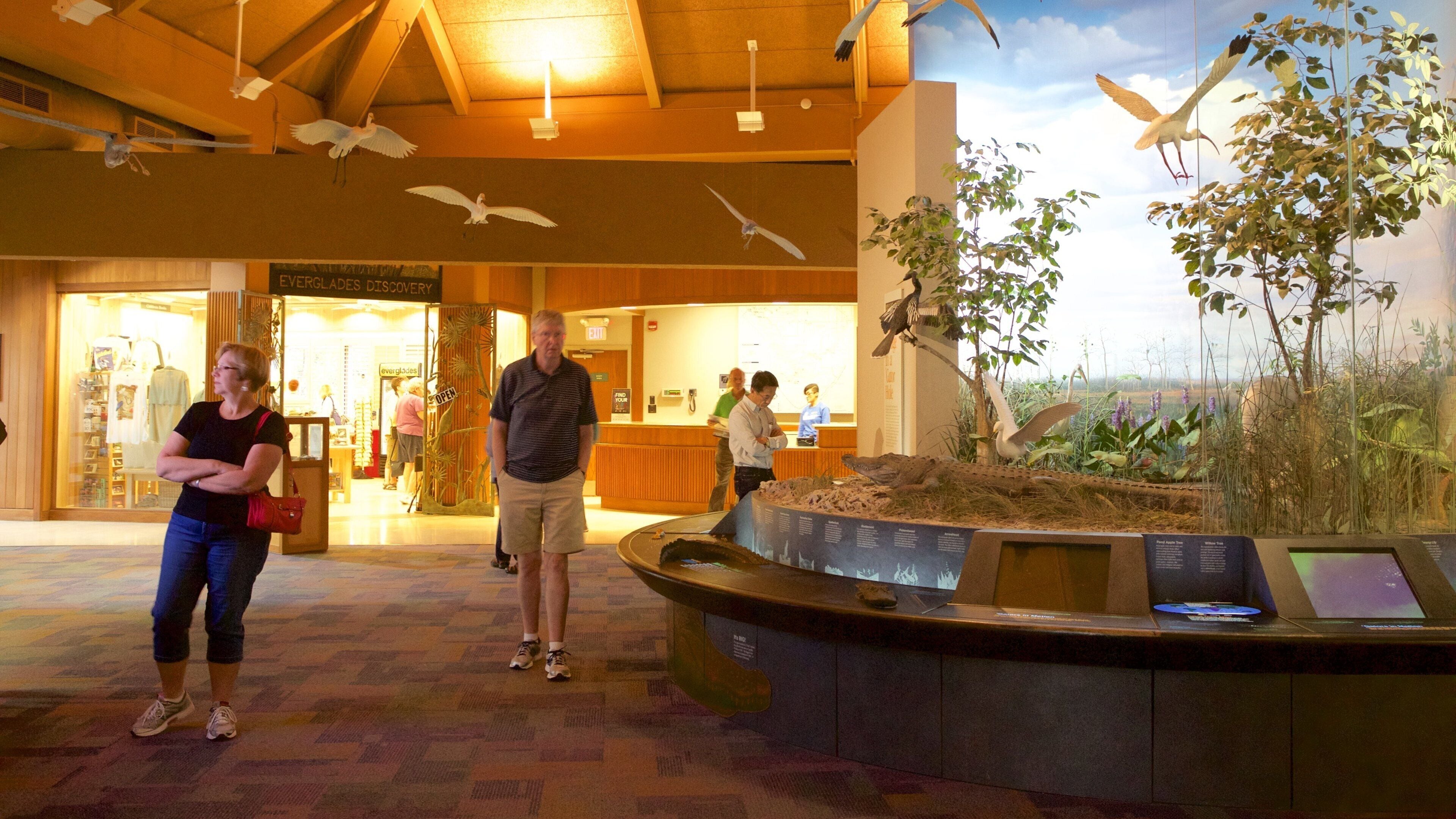 Ernest F. Coe Visitor Center featuring interior views as well as a small group of people