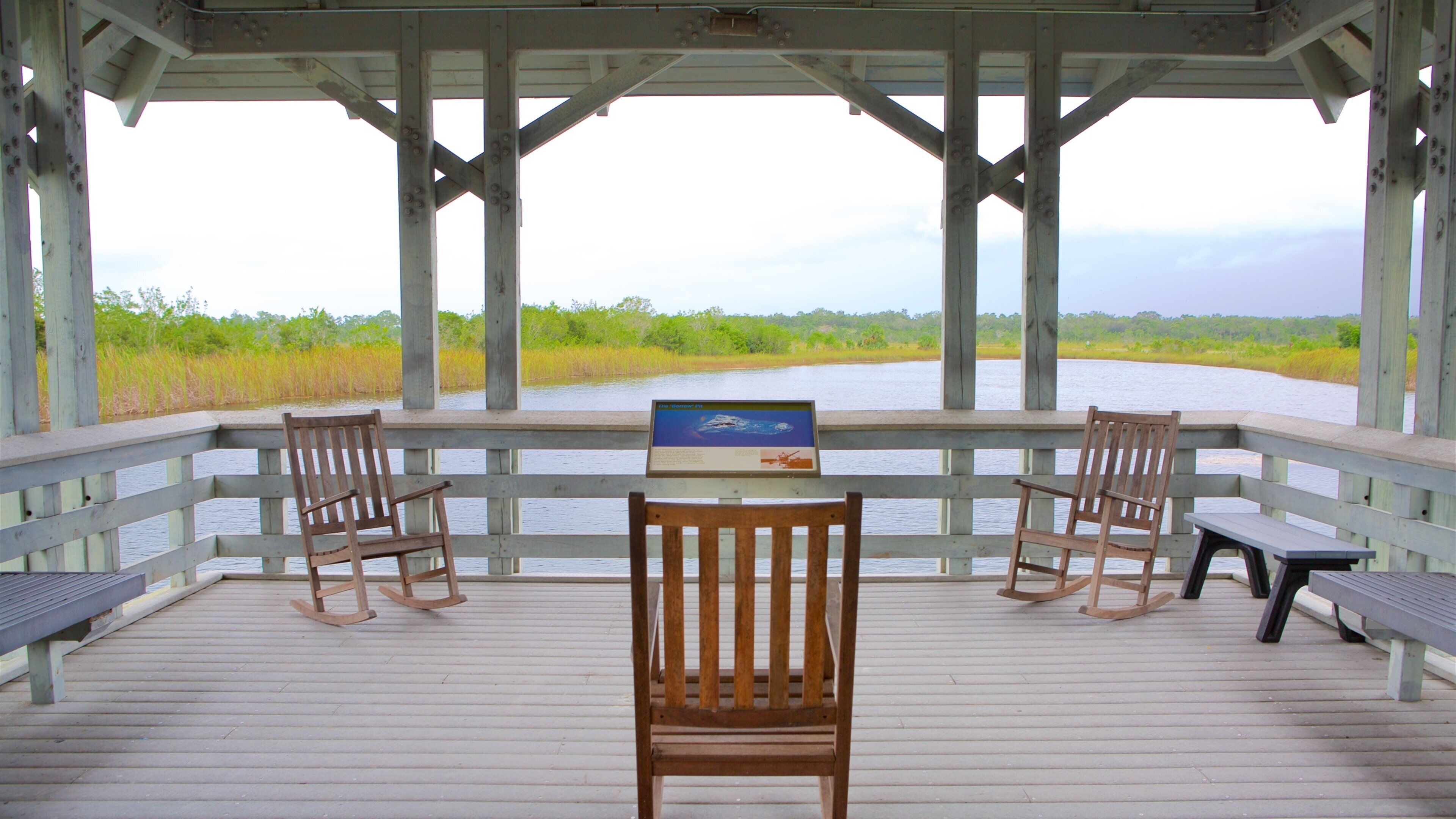 Ernest F. Coe Visitor Center showing views, wetlands and a lake or waterhole
