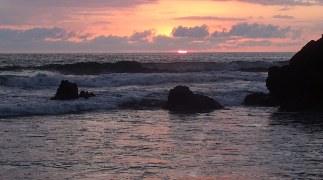 Sunset over the Pacific Ocean from Ostional Beach.
The black sand beach is strewn with white egg shells. Remnants of a recent sea turtle hatchling parade.