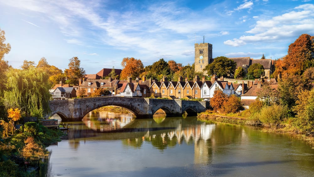 Panoramic view of Aylesford village in Kent, England with medieval bridge over the river Medway during golden autumn time