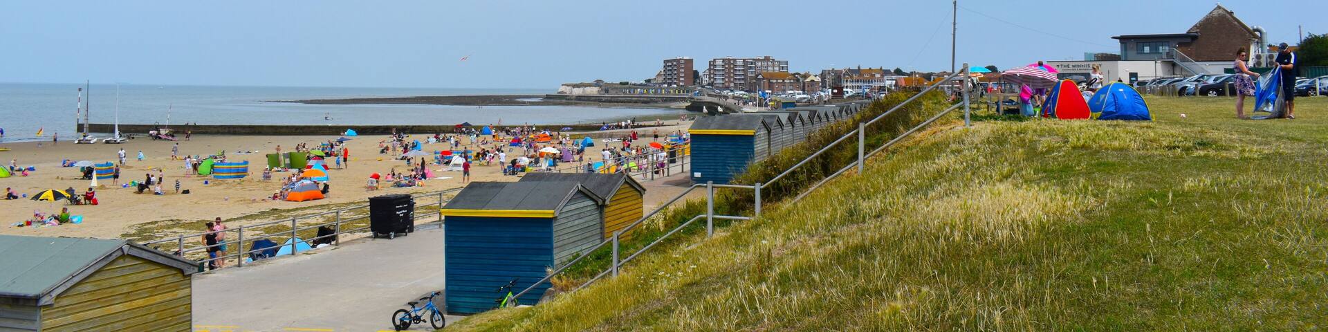 Tourists on their summer holidays, Minnis Bay, Birchington, Kent, UK