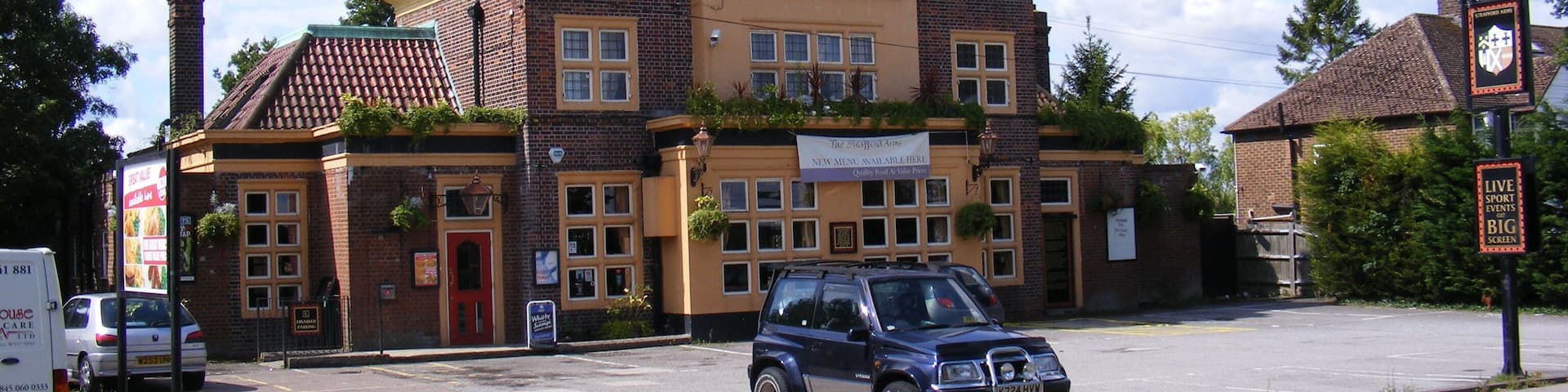 A building with a sign reading "Strafford Arms."