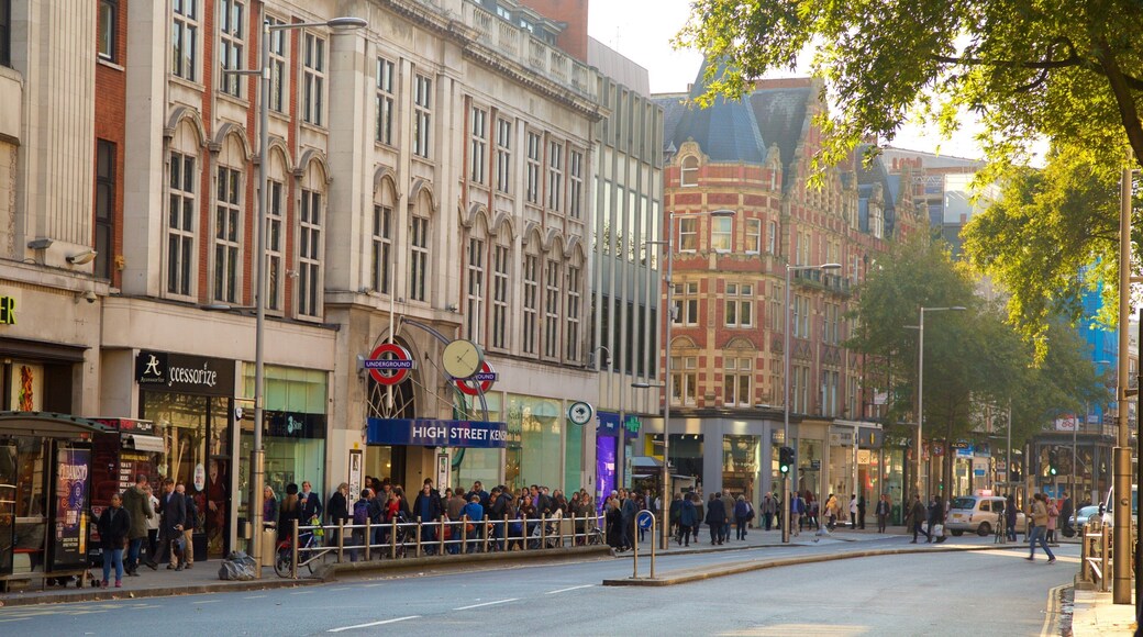Kensington High Street showing heritage architecture and street scenes as well as a large group of people