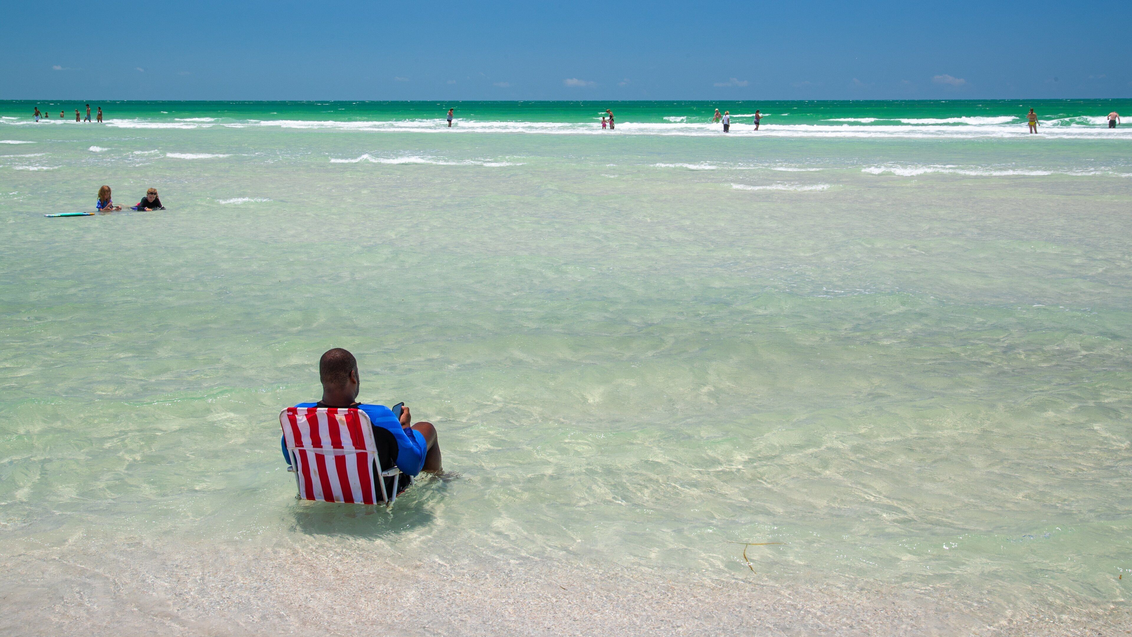 Lido Beach featuring general coastal views as well as an individual male