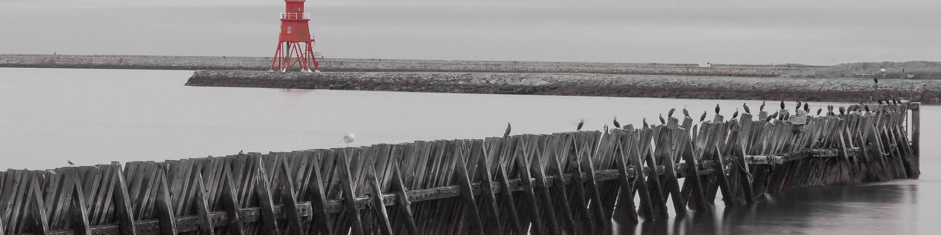 The Herd Lighthouse at South Shields and jetty at North Shields near the fish quay