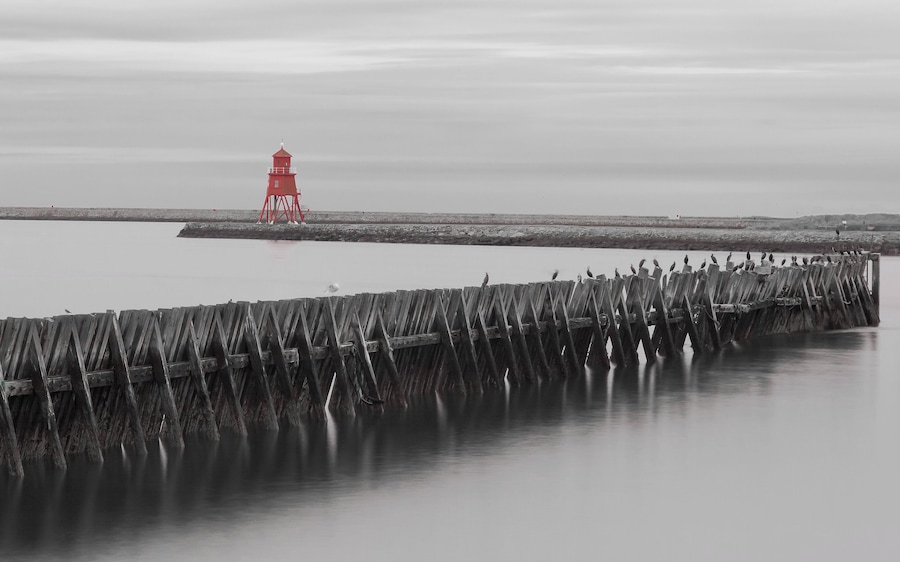The Herd Lighthouse at South Shields and jetty at North Shields near the fish quay