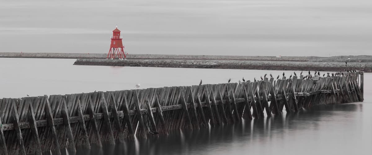 The Herd Lighthouse at South Shields and jetty at North Shields near the fish quay