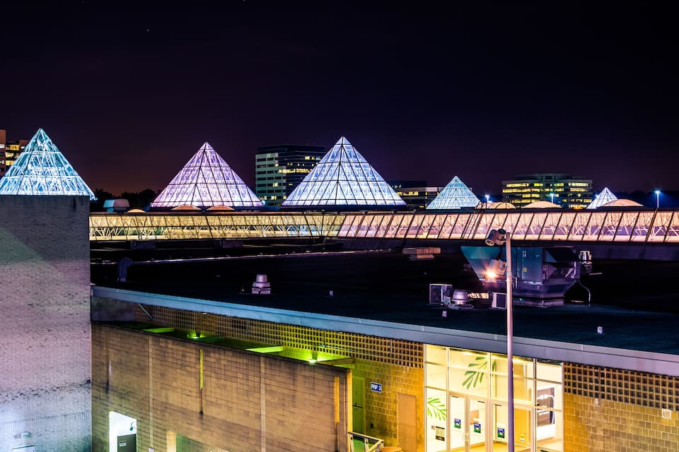 A bridge with illuminated pyramidal structures.