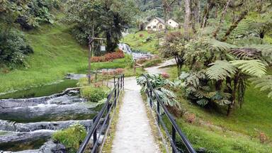 Colombia , Salento 2022 - Termales Santa Rosa de Cabal is a Spa thermal baths immersed in nature outdoors with waterfall and hot water tubs for the well-being of the body - tourist attraction