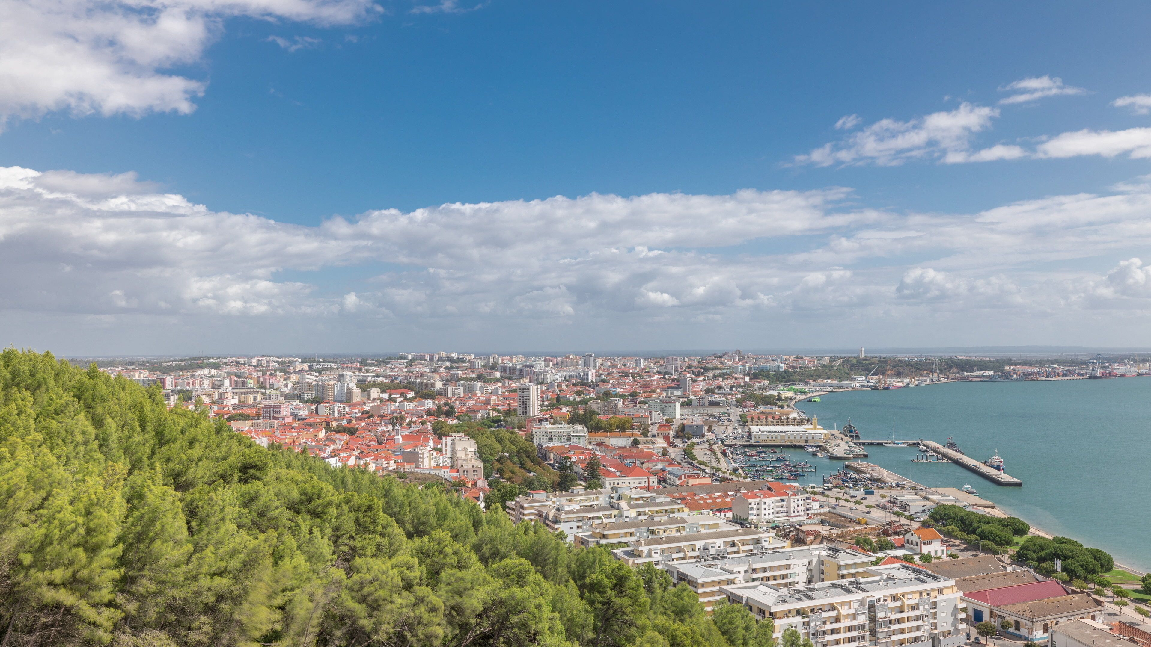 Panorama showing aerial view of marina and city center timelapse in Setubal, Portugal.