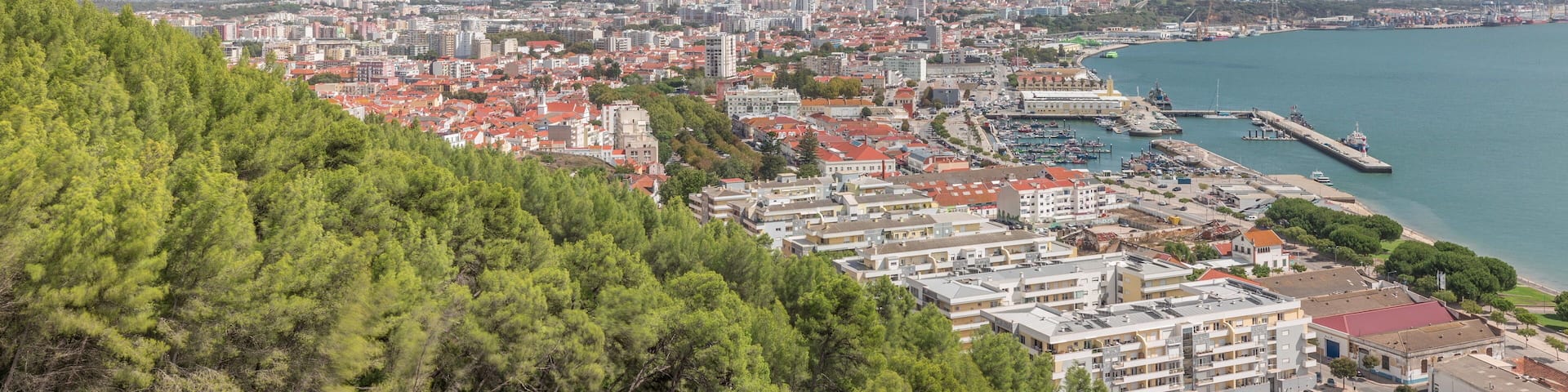 Panorama showing aerial view of marina and city center timelapse in Setubal, Portugal.