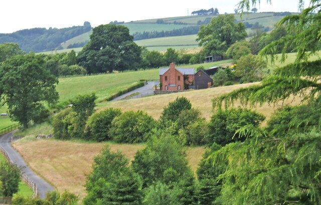 Farm A Shropshire farm in an attractive setting. A public footpath goes along the drive and continues past the farm buildings.