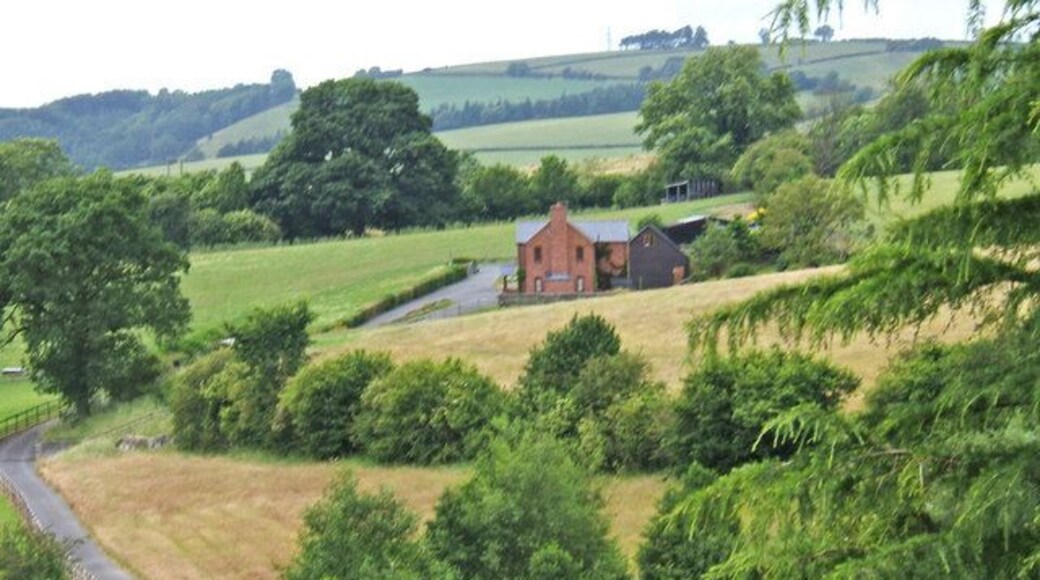 Farm A Shropshire farm in an attractive setting. A public footpath goes along the drive and continues past the farm buildings.
