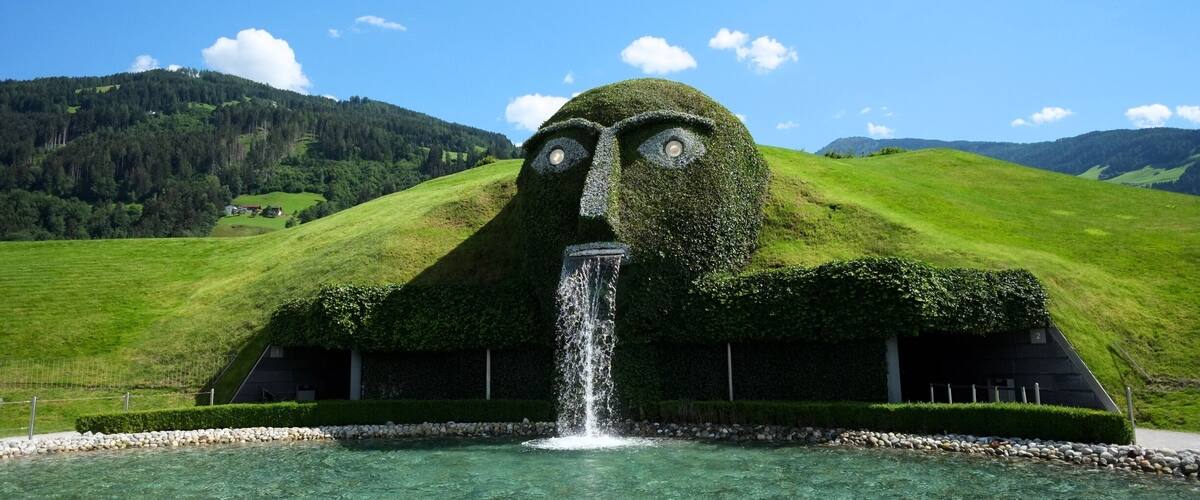 The Swarovski Crystal Worlds is a museum, located in Wattens, Austria. The museum was built in 1995 in celebration of the 100th anniversary of the Austria based crystal company Swarovski.
In 1995, to celebrate the company’s 100th anniversary, Swarovski created Crystal Worlds — a grass-covered giant housing a series of subterranean wonder chambers — conceived by André Heller.
