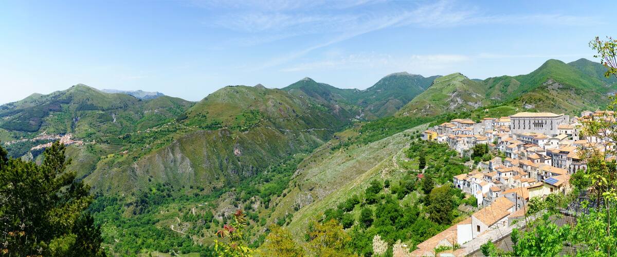 A mountainous landscape with a village nestled among the hills.