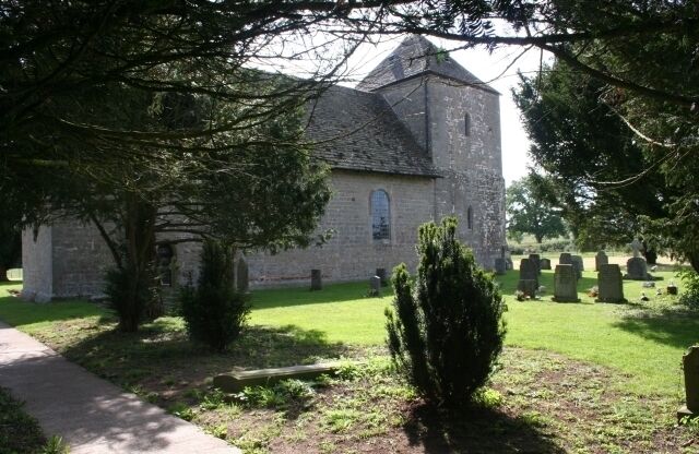 St. Mary's Church, Kempley. Built in local sandstone in the early 12th century. Photograph taken from the gateway.