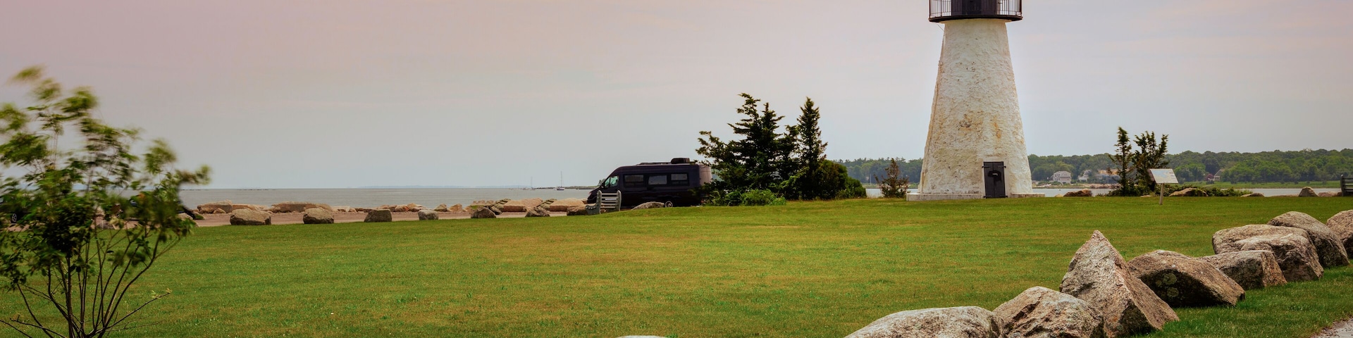Neds Point Lighthouse with Rocks on the Road Side in Mattapoisett, Massachusetts. Historic Landmark Navigational Architecture Built in 1838.