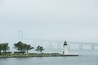 Looking from the Goat Island Causeway across Goat Island to the Jamestown Bridge in the fog.